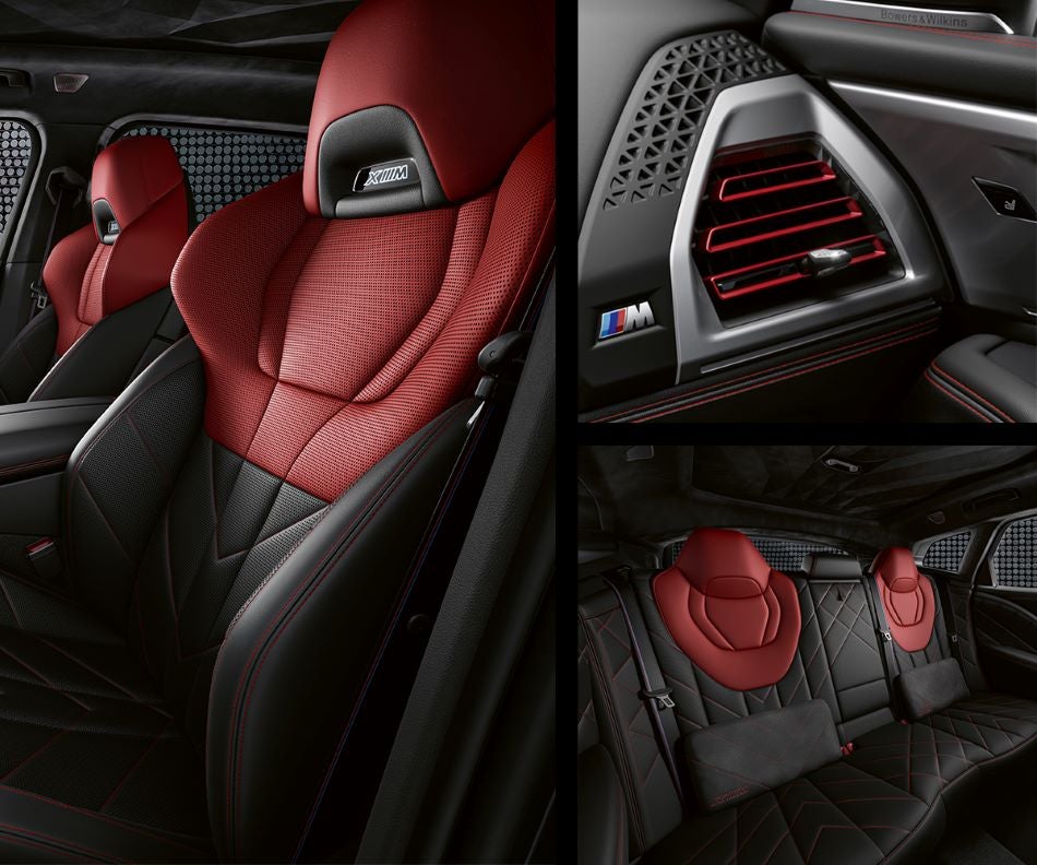 Detail of front seats, clad in exclusive BMW Individual Fiona Red & Black Merino Leather with exclusive M Signature Trim and red stitching and accents. Detail of red accented vent. Detail of rear M Lounge with exclusive XM pillows in Passport BMW | Suitland MD